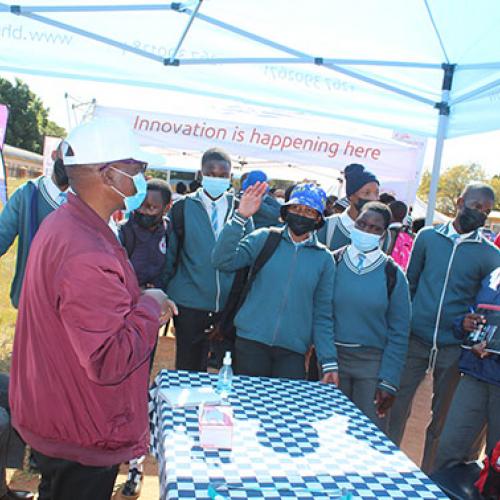 BHP Community Engagement Coordinator, Ernest Moseki interacting with students at My STEM Expo in Mochudi